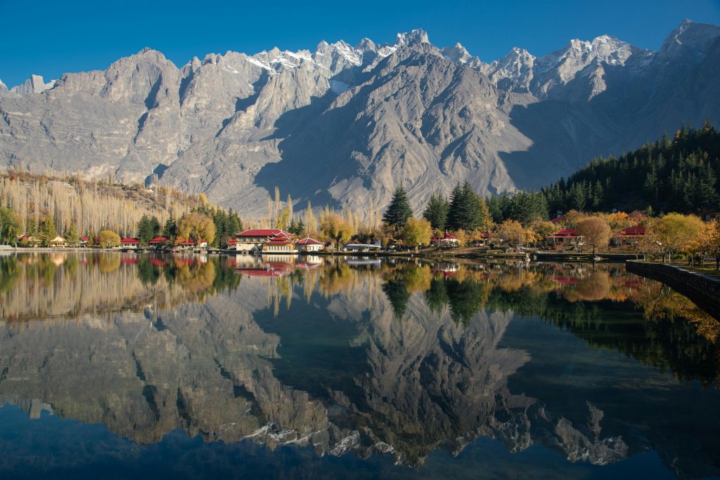 Beautiful reflection of mountains and autumn foliage at Shangrila Lake, Skardu, Pakistan.